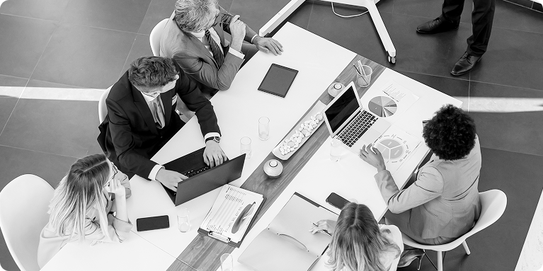 corporate-advisory-business Business team collaborating in a modern office, representing WIUS Capital’s capital raising support for entrepreneurs and growing companies
