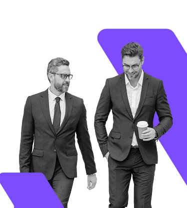 Two business professionals walking together, symbolising WIUS Capital’s partnership approach to delivering tailored investment solutions