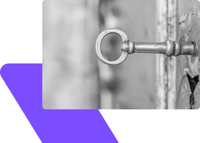 Close-up of a vintage key unlocking a door, symbolising access to insights and opportunities in investment.
