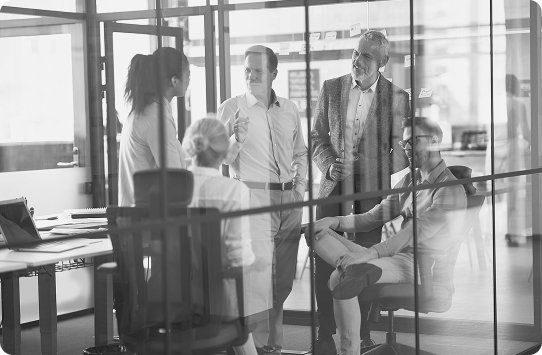 why-companies-choose-us-benefits Business team collaborating in a modern office, representing the benefits companies gain by partnering with WIUS Capital