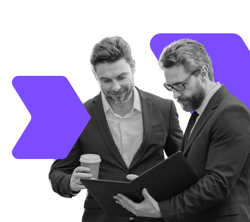 wo business professionals reviewing documents, symbolising why investors choose WIUS Capital for trusted investment partnerships