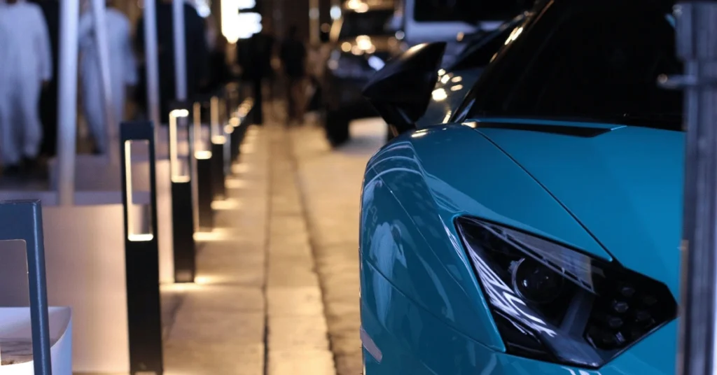 Luxury car on a city street at night, symbolising exclusivity and wealth, used to illustrate a WIUS Capital blog on private credit vs bonds and how investors assess protection and returns.