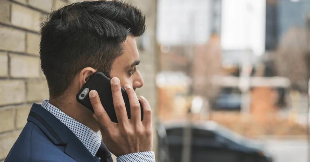 Business professional on a phone call, representing investor decision-making in evaluating private credit vs bonds for portfolio protection.