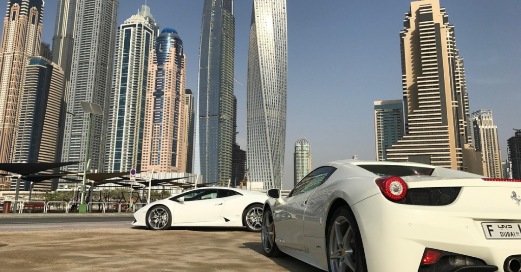 Dubai city skyline with modern towers and luxury vehicles in the foreground, symbolising global private markets, capital access, and WIUS Capital’s international perspective.