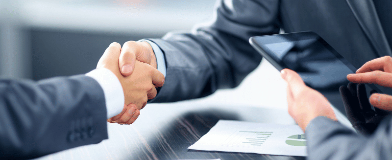 Private consultation between an investor and adviser discussing alternative investments, strategy, and capital allocation.