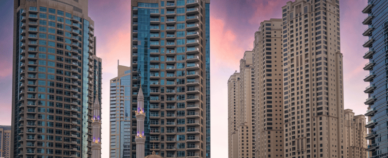 Dubai skyline with residential and commercial towers at sunset, representing regional investment markets, capital flows, and private market opportunity.